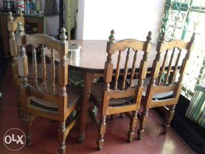 Oval Brown Wooden Table With Four Chairs