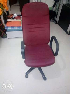 Red color office chair in good condition.