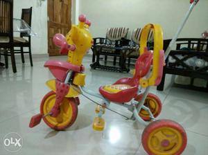 Tricycle in good condition yellow and red color combination
