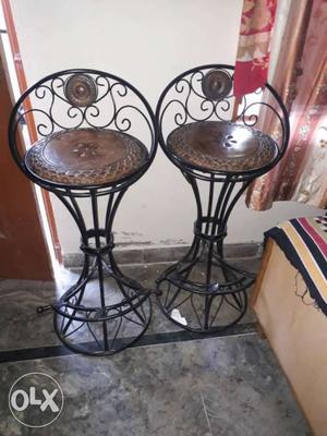 Two Black Metal-framed Brown Wooden Padded Stools