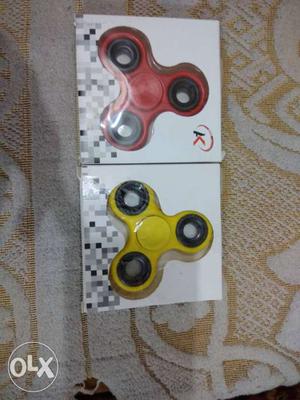 Two Red And Yellow 3-blade Fidget Spinners