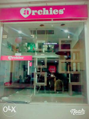 White And Pink Archies Store Facade
