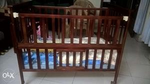 Wooden baby cot, good condition.