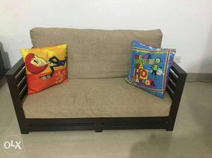 Wooden sofa two seater 6 months old with seating