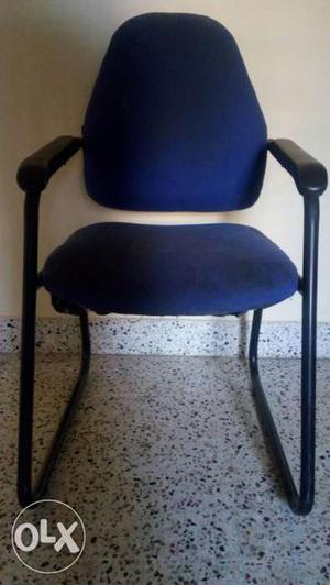 2 metal chairs with cushioned seating