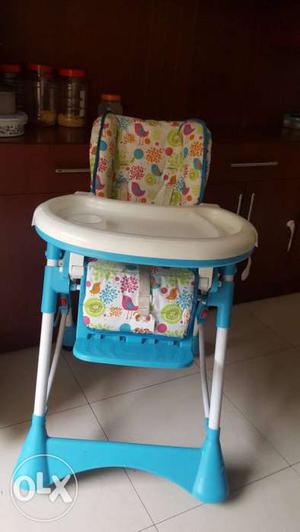 Baby's White And Multicolored Floral Highchair With Feeding