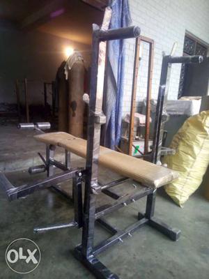 Beige And Black Bench Press With Power Tower