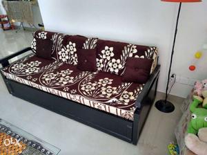 Black And Red Floral Couch With Throw Pillows