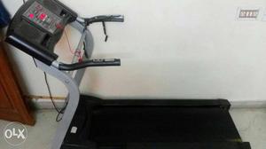 Black and grey treadmill in good condition.