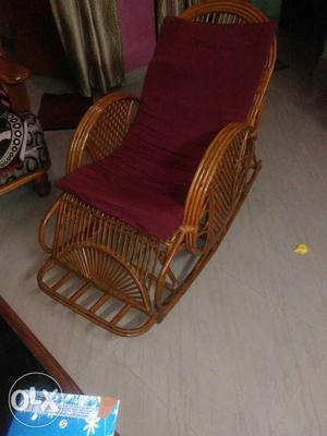 Brown Bamboo Rocking Chair With Red Cushion