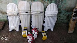 Four White Cricket Pads
