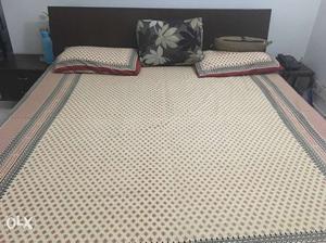 King size bed with one side table and includes