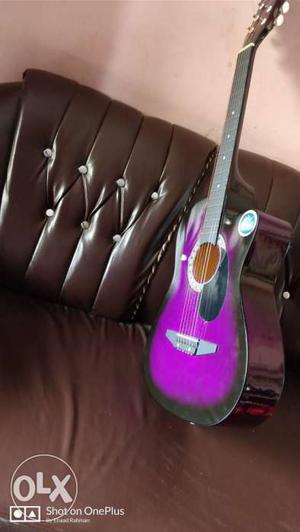 Purple, Black, And Red Acoustic Guitar