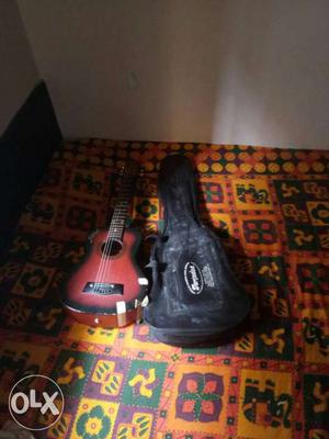 Red And Black Acoustic Guitar With Gig Bag