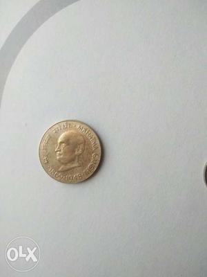 Silver-colored Mahatma Gandi Coin