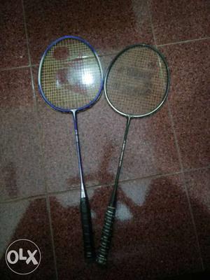 Two Black And Blue Yonex and jonex Badminton Rackets