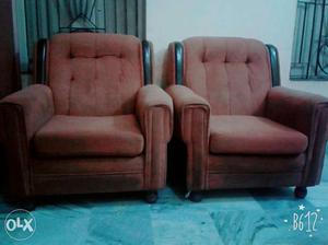 Two Brown Cushion Armchairs