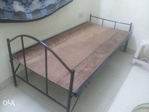 Wrought iron with wood cots of 1 year. No 2 cots.