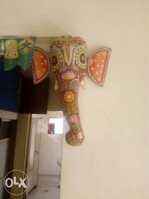 A pair of paper mache wall hanging.