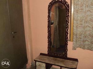 A wooden antique carved dressing table for sale