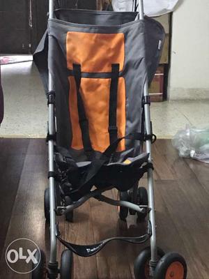 Baby's Gray And Orange Stroller