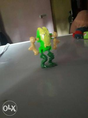 Green And Yellow Action Figure
