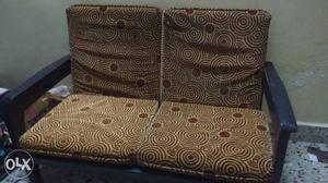 Pure teak wood two seater sofa Brand new cushions.