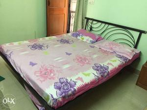 Queen size wrought iron bed including new mattress