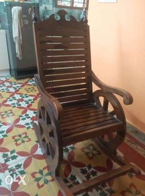 Sparingly or no used seasame wood rocking chair.