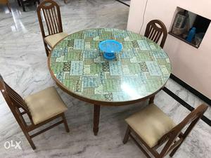Teak wood made dining table with 4 chairs mounted