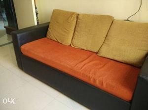 Black And Brown Fabric Sofa With Throw Pillows