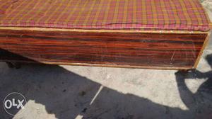 Brown Wooden Bed Frame With Red Bed Mattress singh bad good
