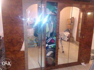 Brown Wooden Closet With Mirrors