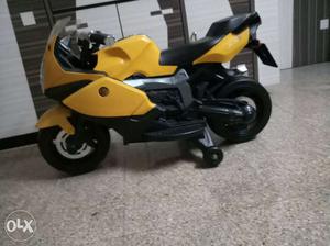 Children's Black And Yellow Ride On Sports Bike Toy