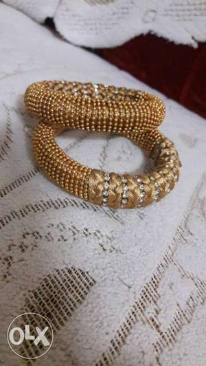 Gold colour silk thread bangles for official use.