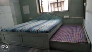 King Size wooden bed with pullout double bed and