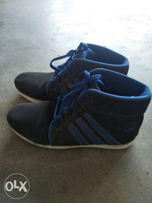 Pair Of Black And Blue High-top Sneakers