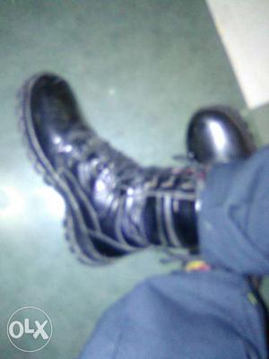 Pair Of Black Leather Combat Boots
