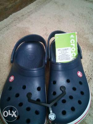 Pair Of Blue-and-white Crocs Rubber Clogs