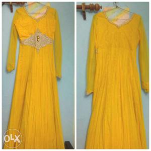 Party wear yellow gown with heavy jarkan worl