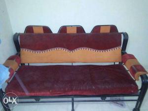 Red And Orange Fabric Sofa With Black Metal Base