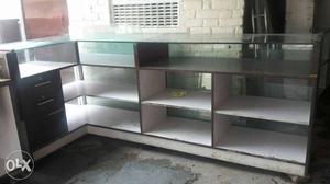 White And Brown Wooden Display Counter