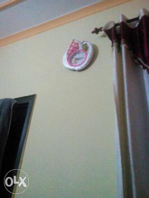 White And Pink Wall Clock