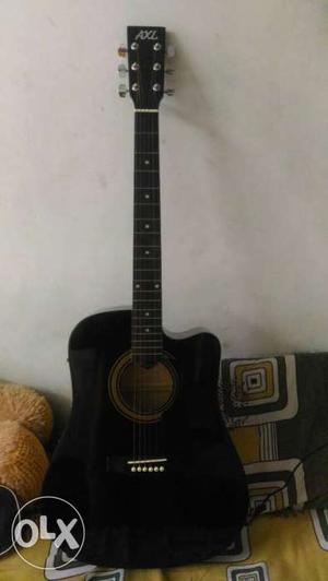 A brand new axl acoustic jumbo guitar