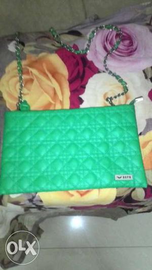 Green bern quilted sling bag in a new condition.