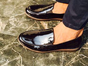Pair Of Black Patent Leather Slip-on Shoes
