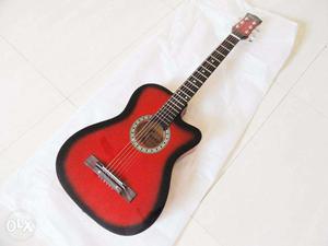 Red black imported guitar unused