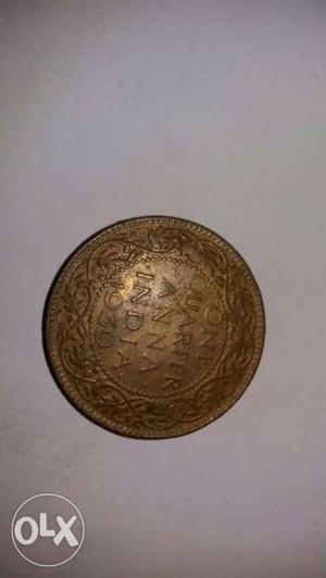 Round  Gold-colored One Quarter Anna Coin