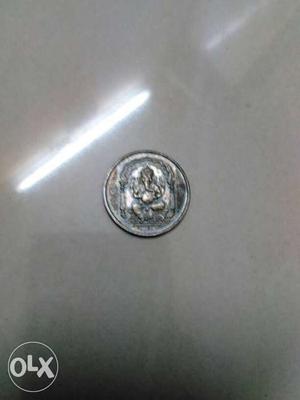 Round Silver Ganapathi on one side and om on other side coin