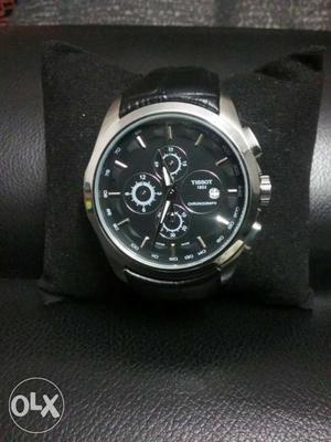 Round Silver-colored Chronograph Watch With Black Leather